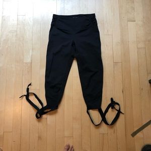 Black Manduka crop leggings with tie bottoms